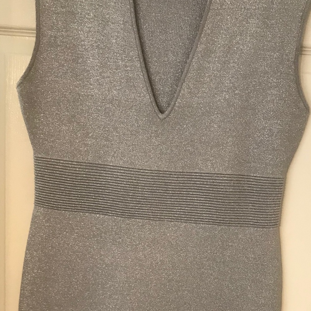 Mid length silver grey dress.